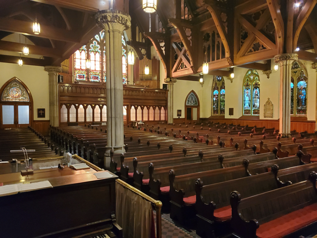 The cross and candles on the altar